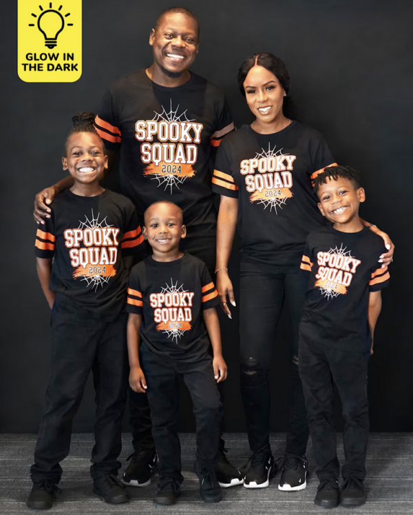 Family with matching glow in the dark Halloween outfits