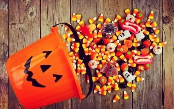 Halloween bucket with candy spilling out