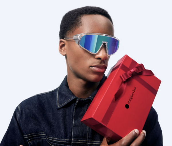 Man wearing sunglasses wiht gift