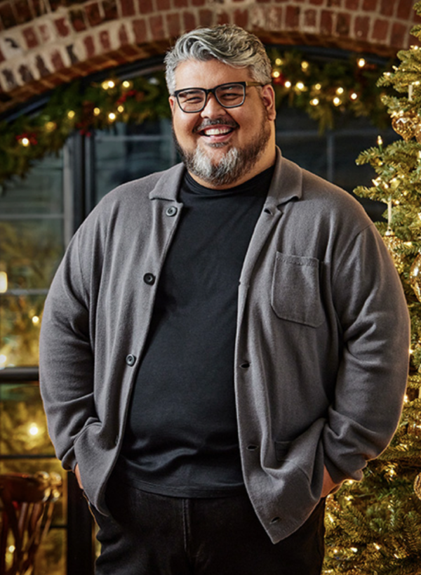 Smiling man in gray sweater