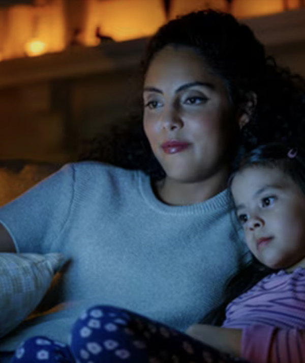 Mother and daughter watching holiday movie